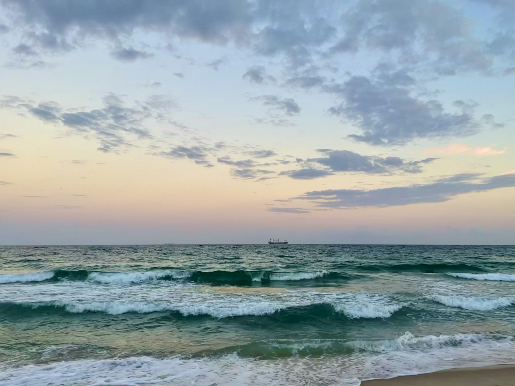 Atlantic waves along Fort Lauderdale Beach beneath a wide coastal sky