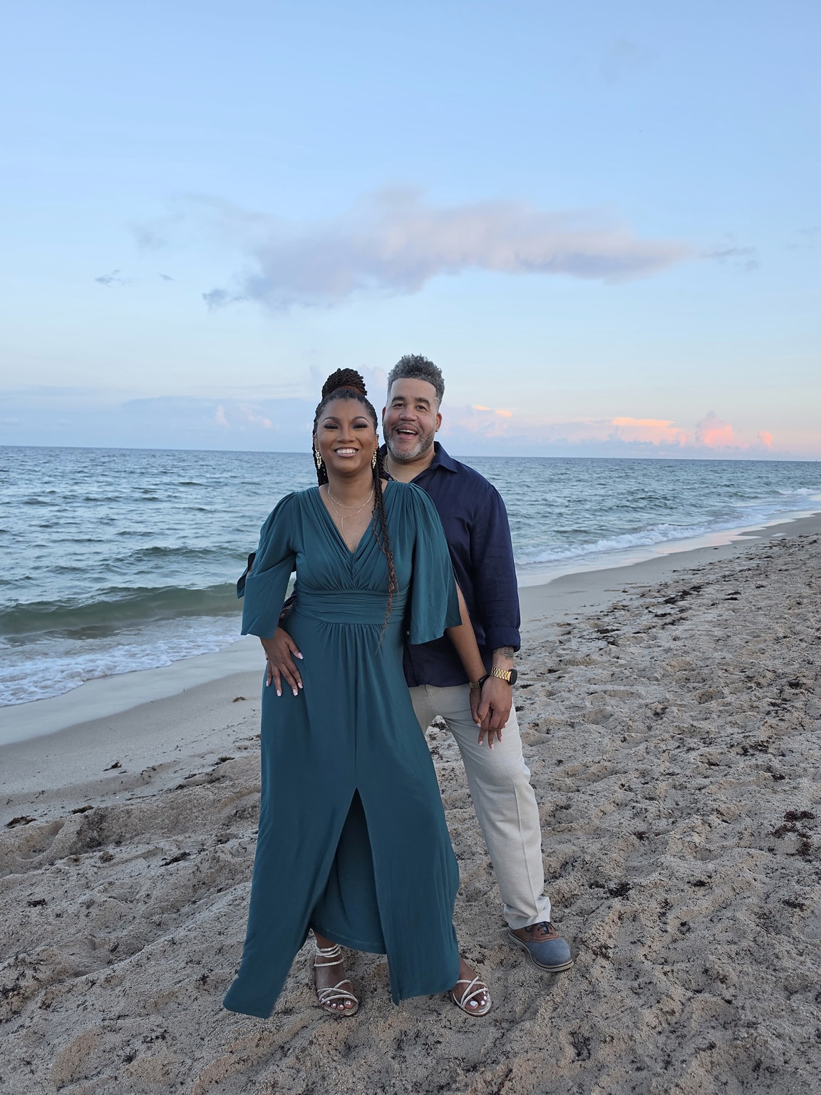 TK and Guerry smiling together on the beach in South Florida